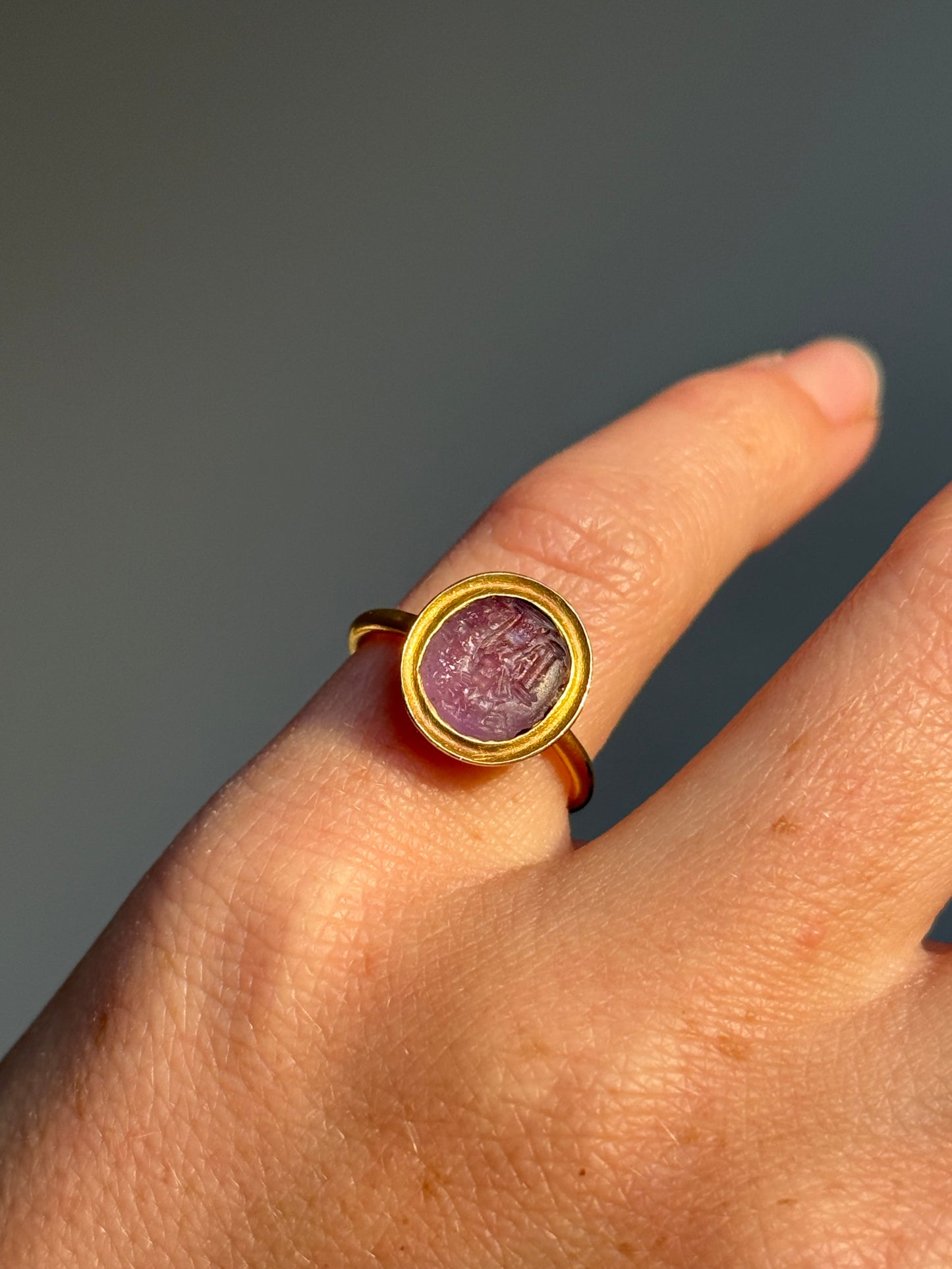 Roman Amethyst Intaglio Ring in 18 Carat Gold; Circa 1800