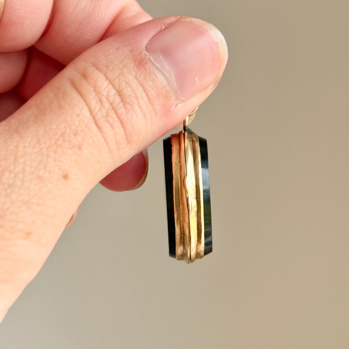Antique 'E' Onyx Oval Locket in 9 Carat Gold; Circa 1895