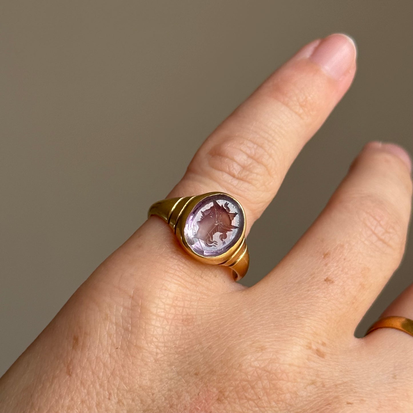 Antique Amethyst Intaglio Ring in 18 Carat Gold; Circa 1900
