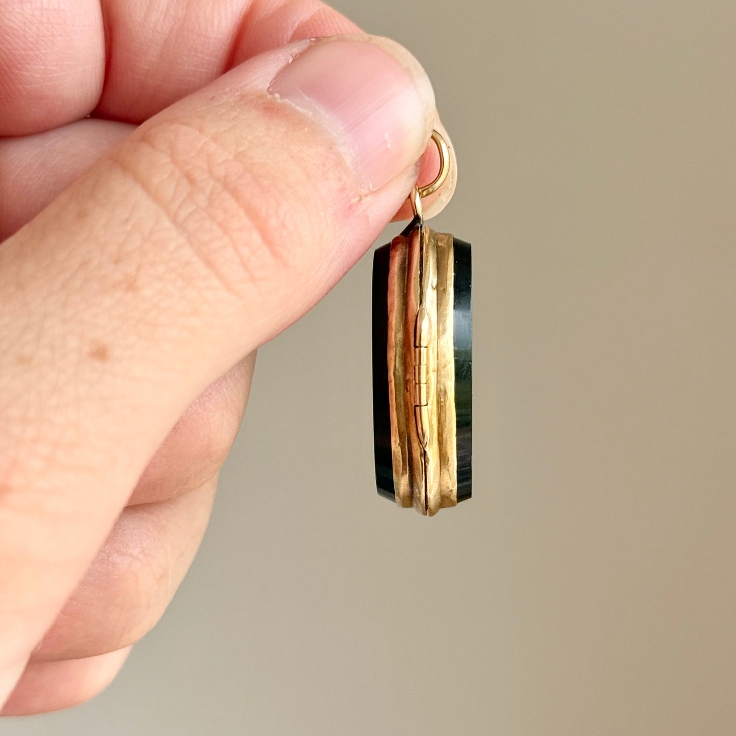 Antique 'E' Onyx Oval Locket in 9 Carat Gold; Circa 1895