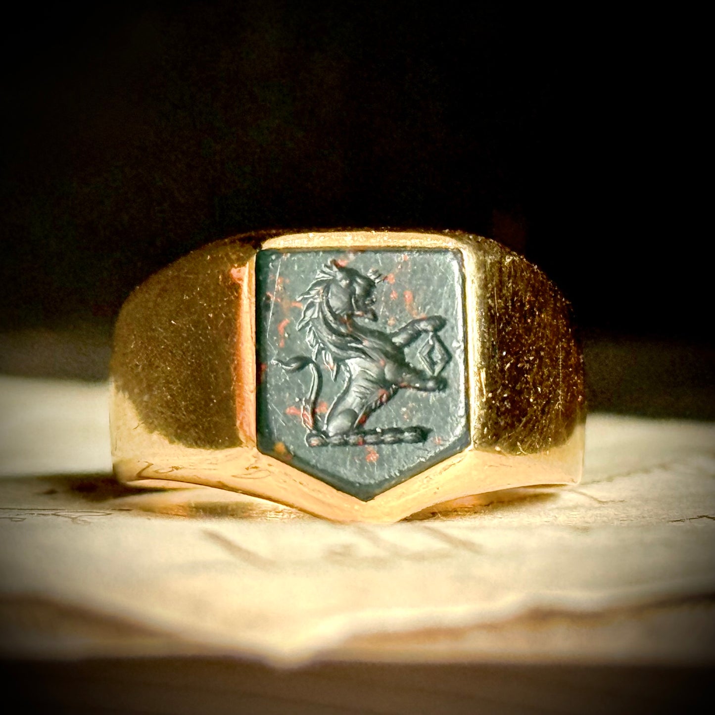Antique Bloodstone Lion Signet Ring in 18 Carat Gold; Circa 1880