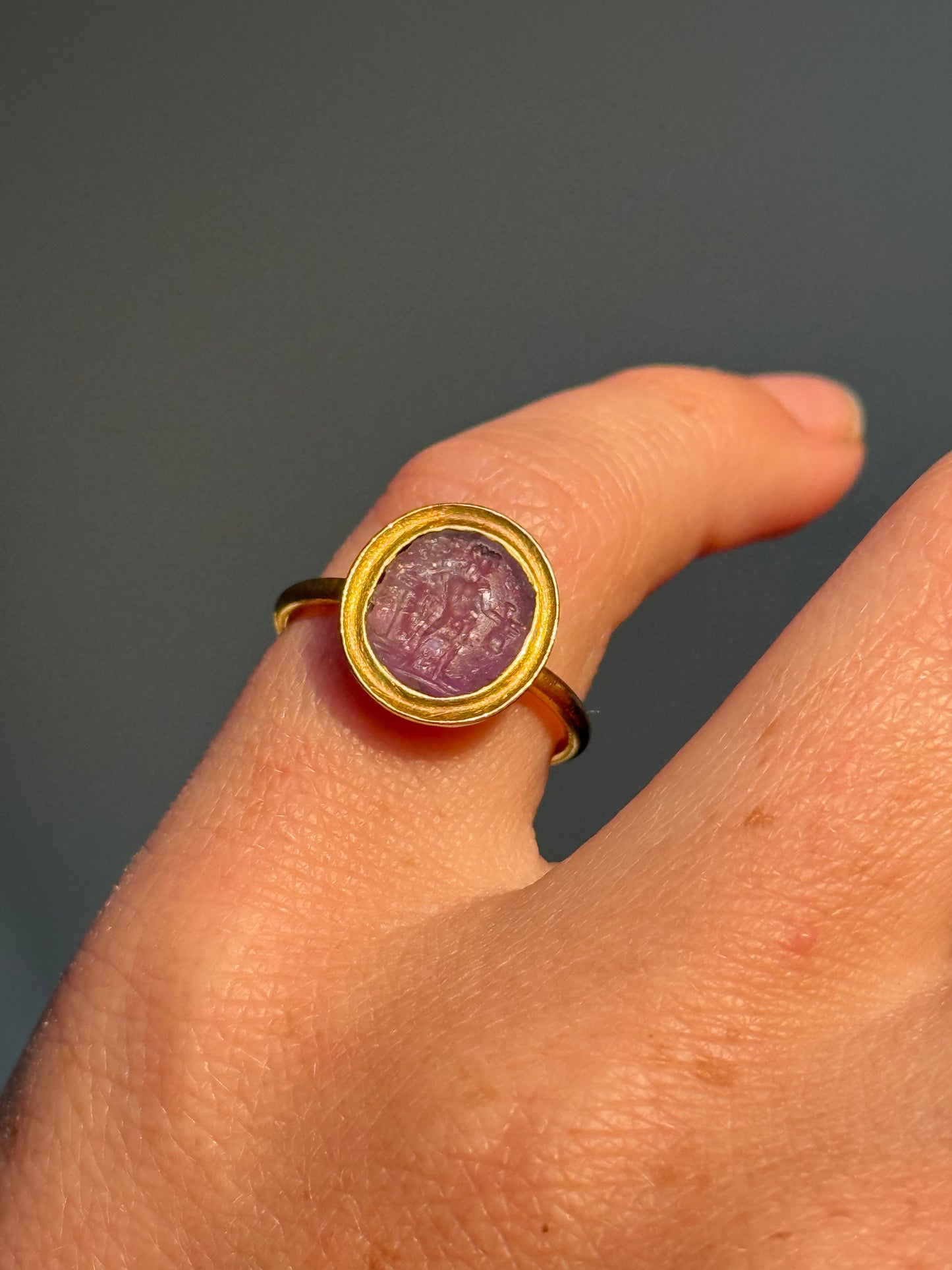 Roman Amethyst Intaglio Ring in 18 Carat Gold; Circa 1800