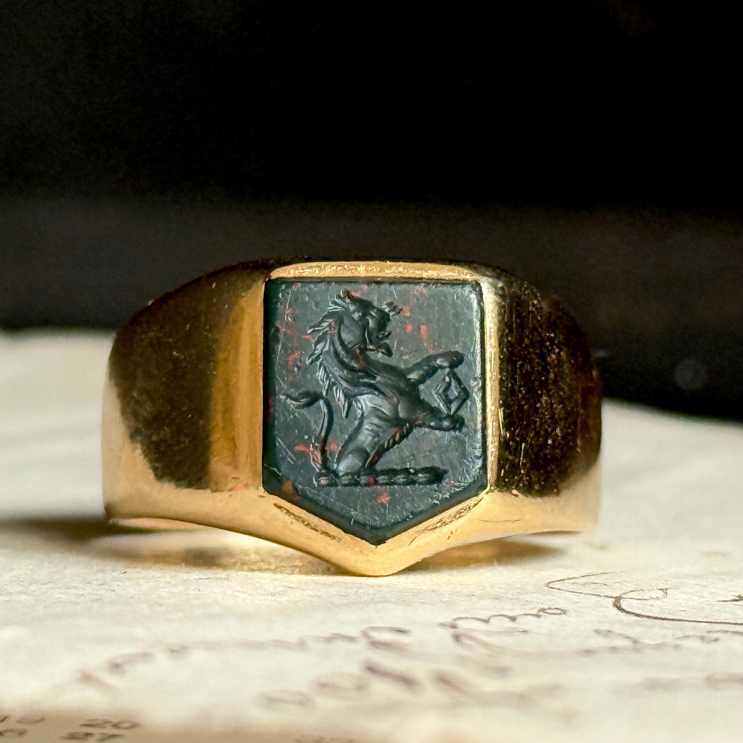 Antique Bloodstone Lion Signet Ring in 18 Carat Gold; Circa 1880