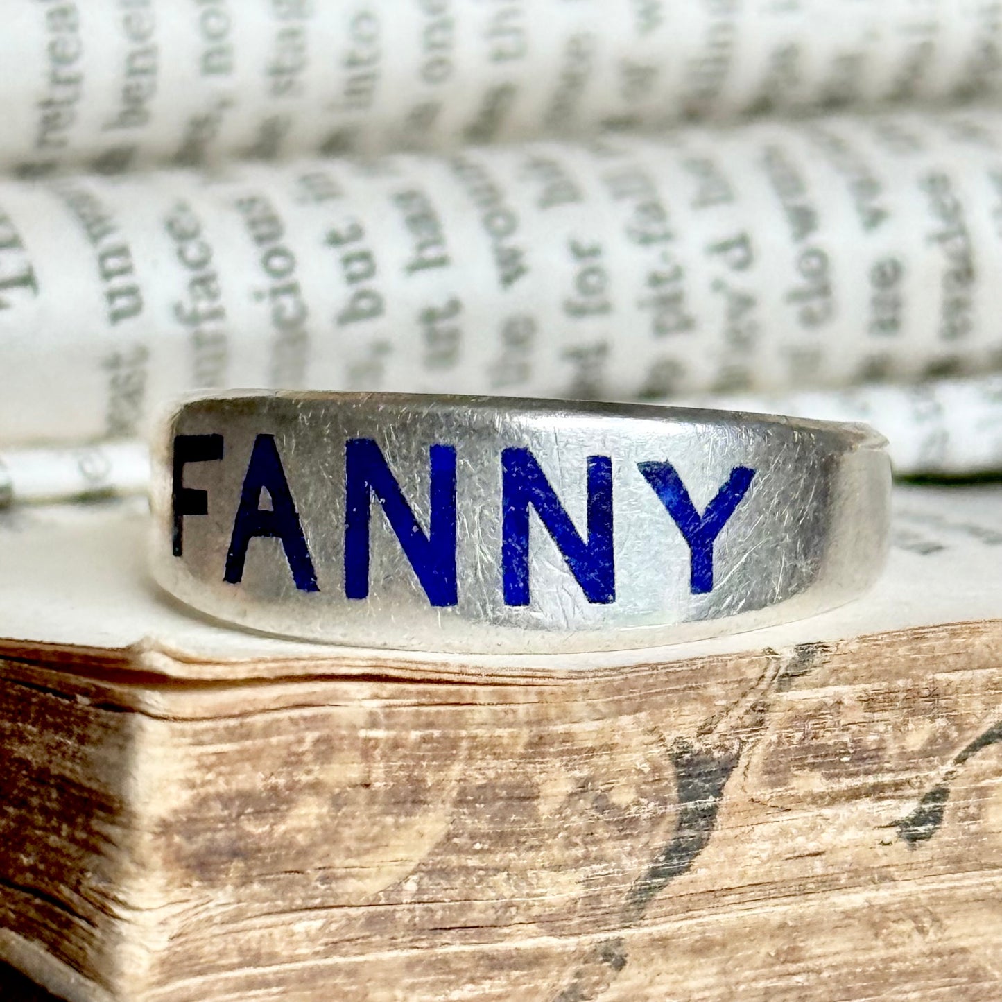 Victorian 'Fanny' Enamel Ring In Silver; Circa 1879