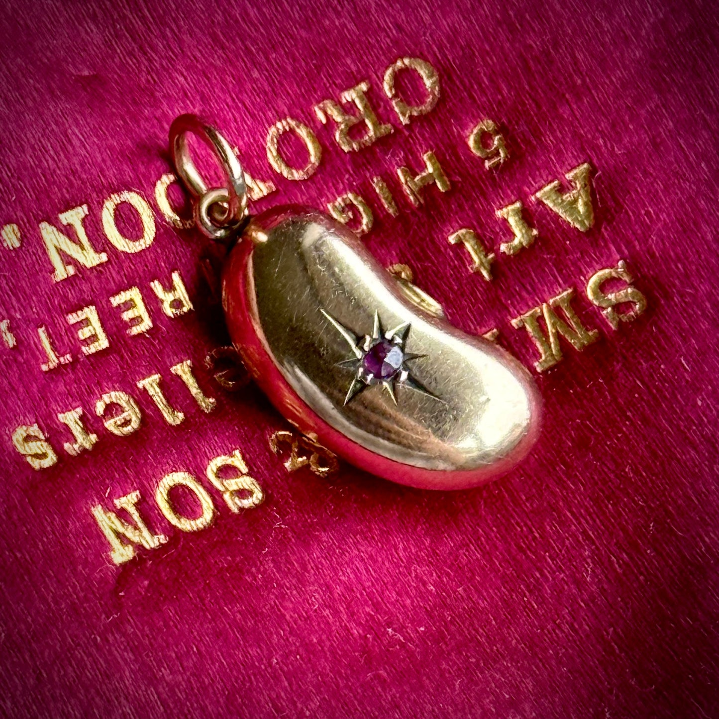 Victorian Lucky Ruby Kidney Bean Pendant 9 Carat Gold; Circa 1860