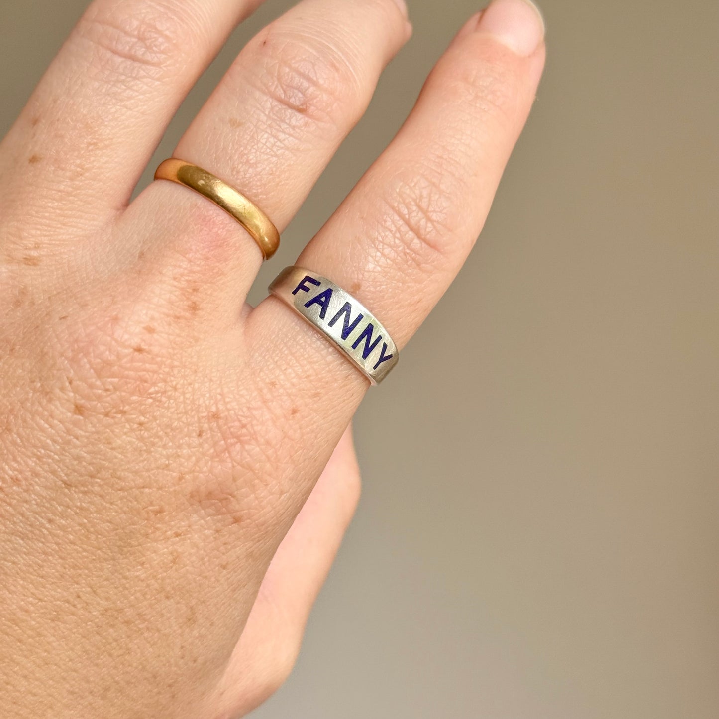 Victorian 'Fanny' Enamel Ring In Silver; Circa 1879