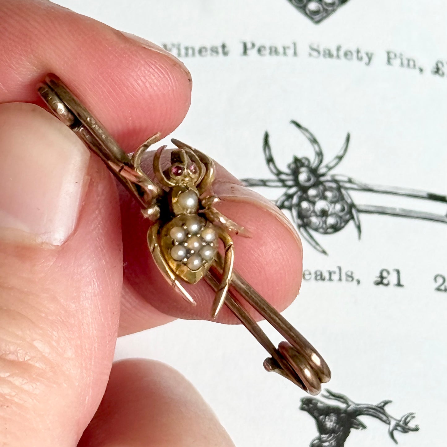 Victorian Spider Ruby and Pearl Brooch in 9 Carat Rose Gold; Circa 1890
