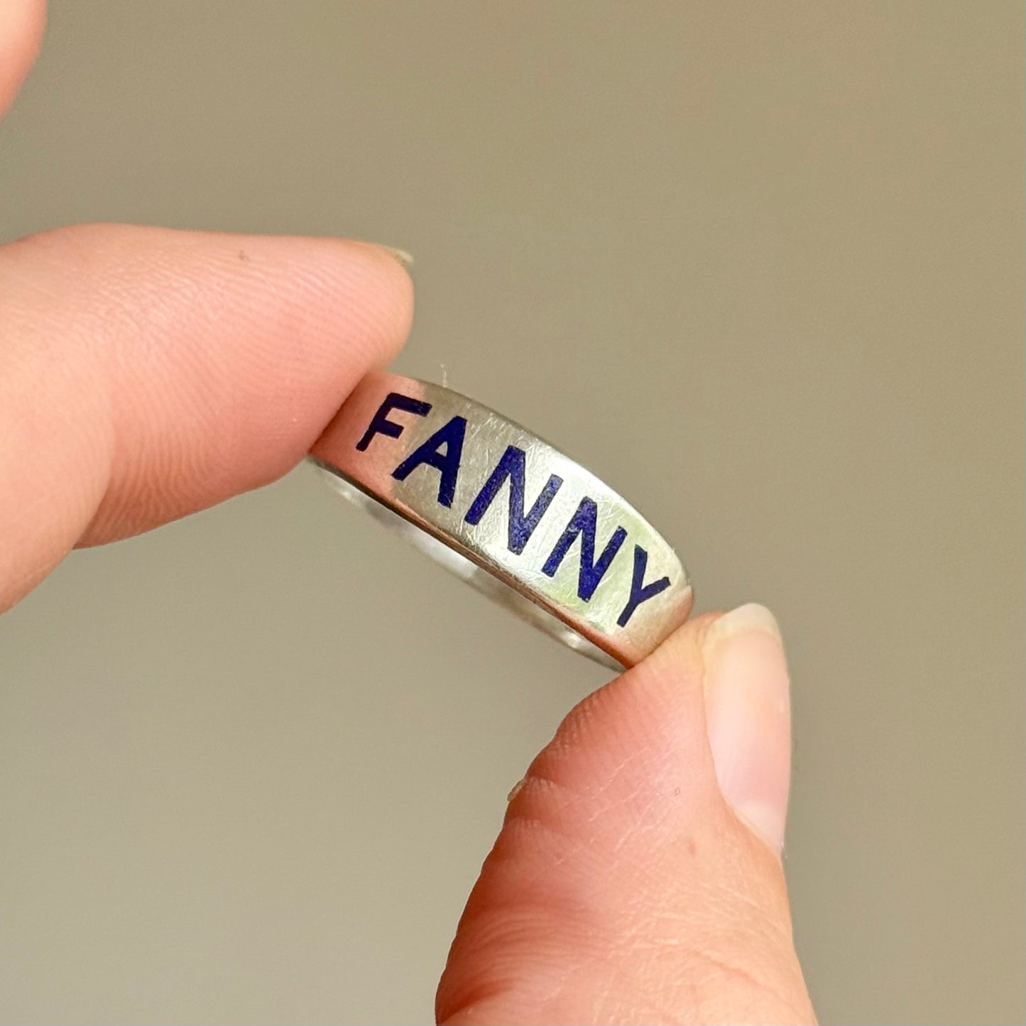Victorian 'Fanny' Enamel Ring In Silver; Circa 1879