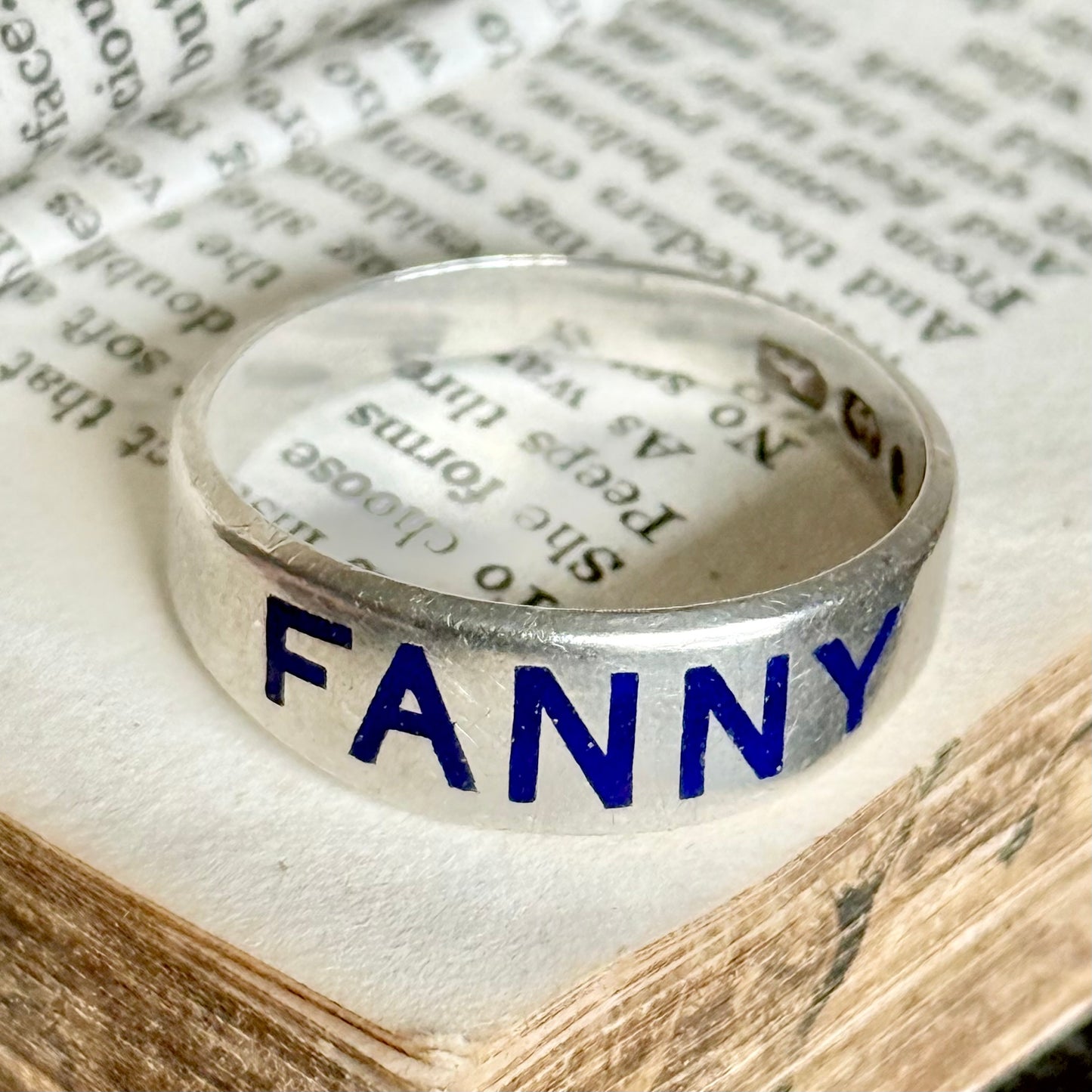 Victorian 'Fanny' Enamel Ring In Silver; Circa 1879