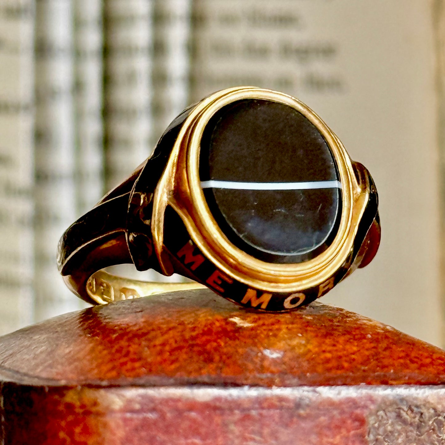 Early Victorian Agate & Enamel Mourning Ring in 18 Carat Gold; Circa 1849