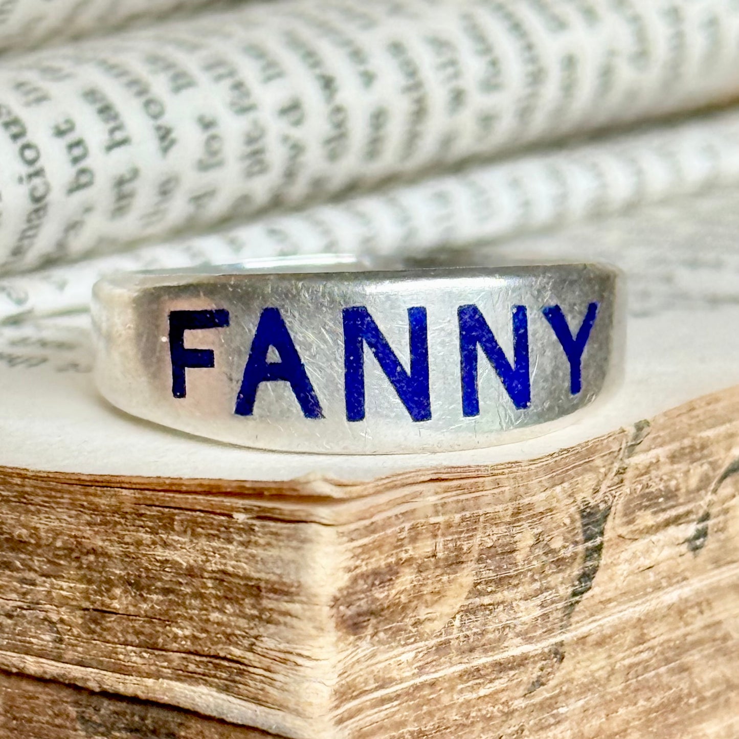 Victorian 'Fanny' Enamel Ring In Silver; Circa 1879