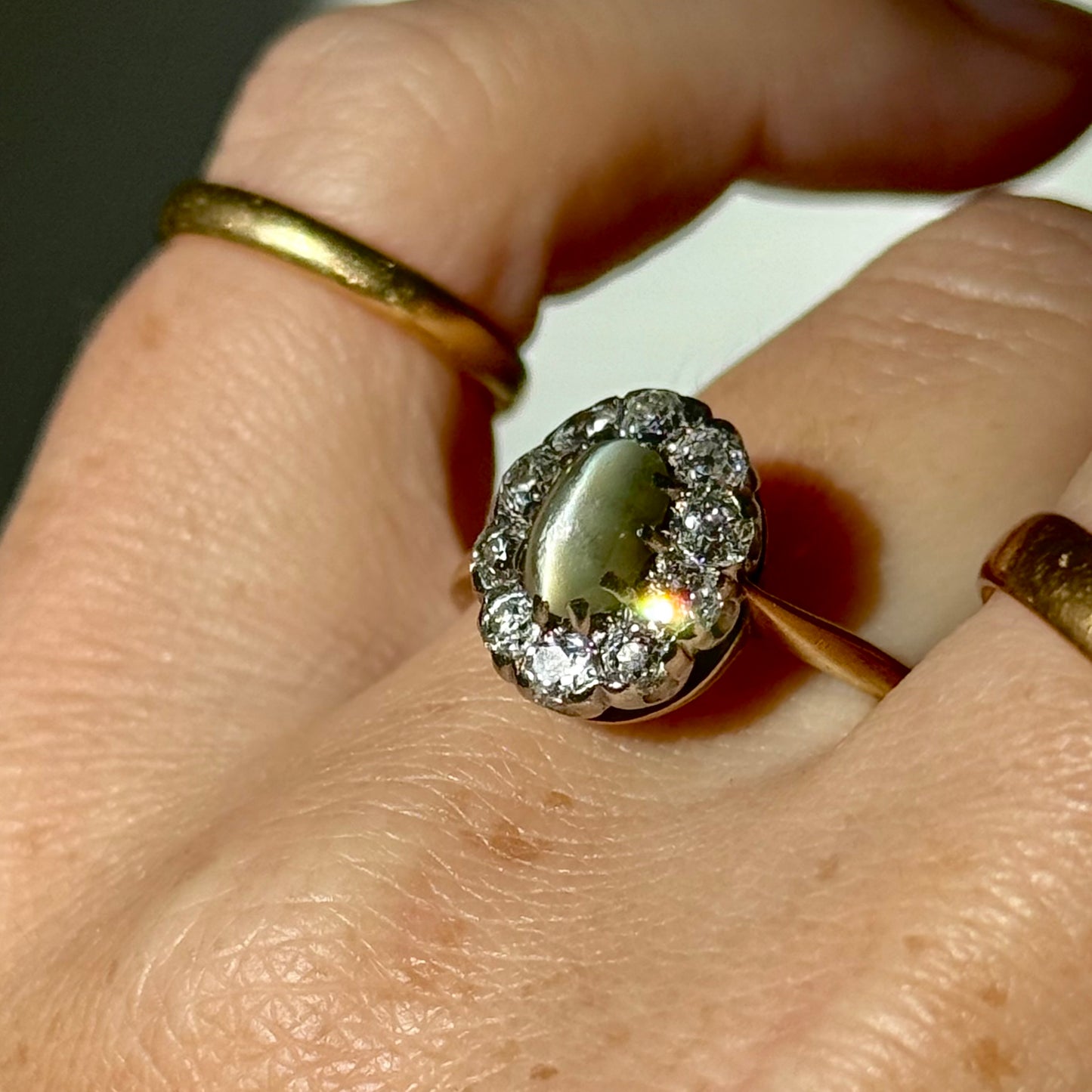 Antique Cat’s Eye Chrysoberyl & Diamond Halo Ring in 18 Carat Gold