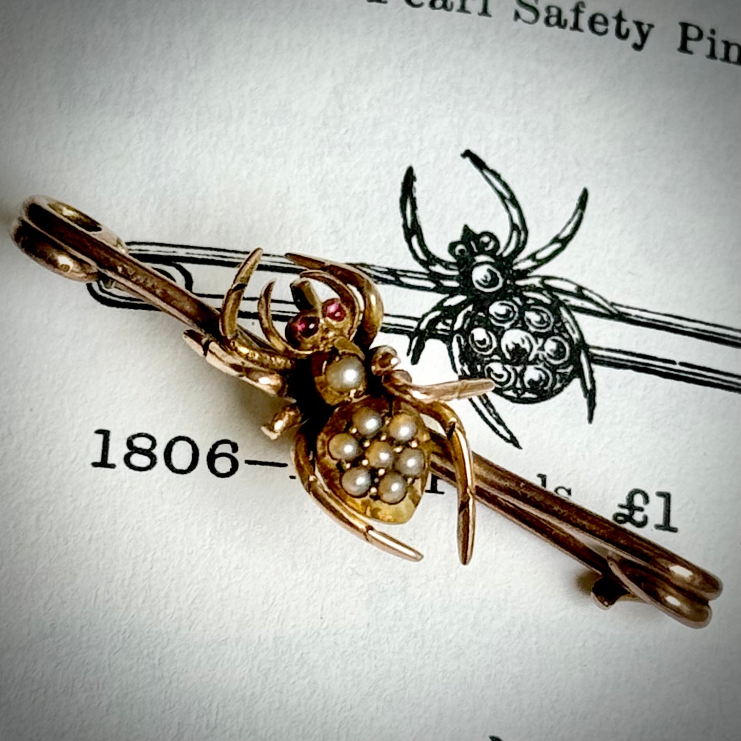 Victorian Spider Ruby and Pearl Brooch in 9 Carat Rose Gold; Circa 1890