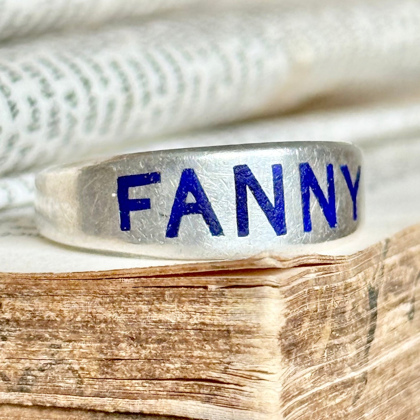 Victorian 'Fanny' Enamel Ring In Silver; Circa 1879