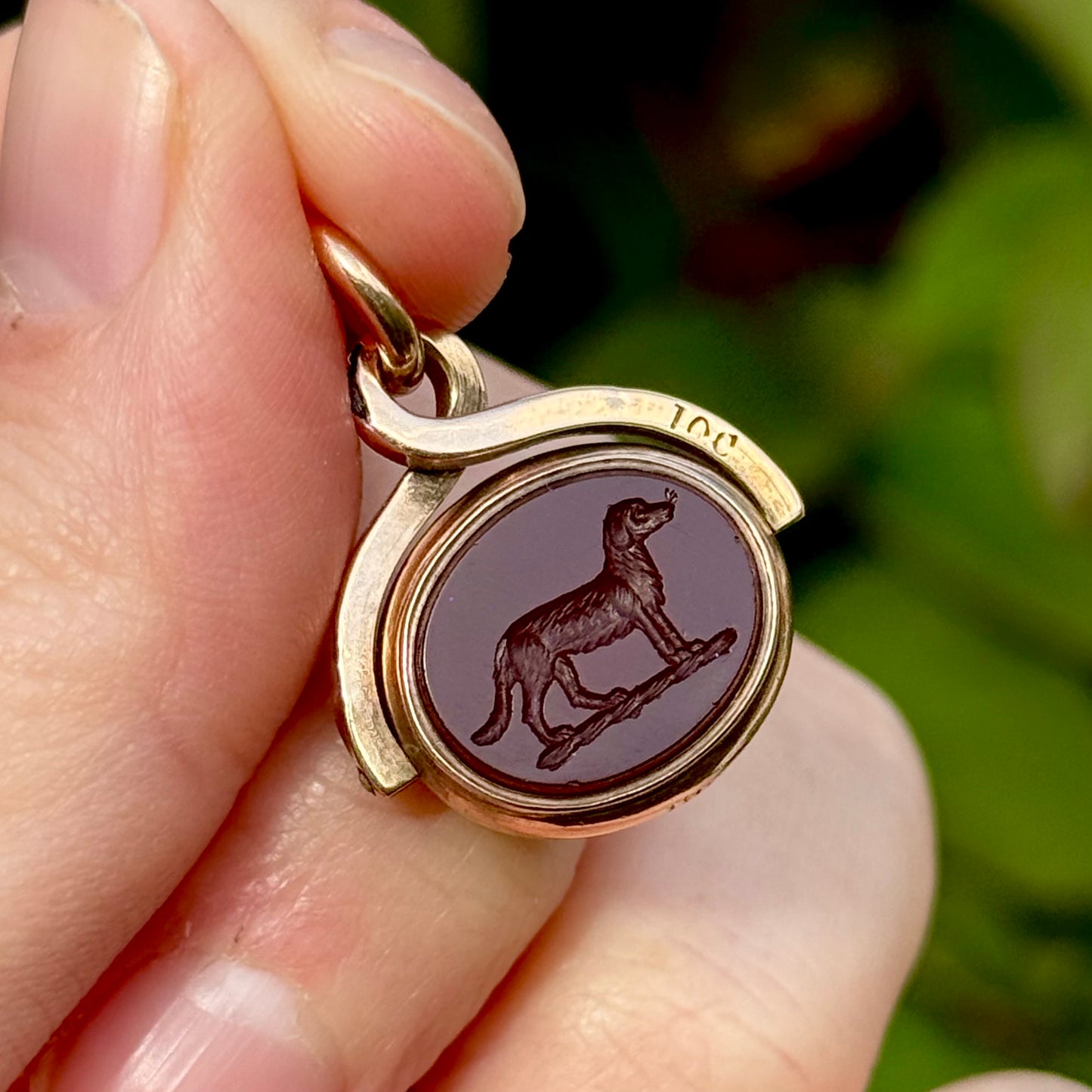Antique Swivel Intaglio Dog  Pendant in 10 Carat Gold; Circa 1900