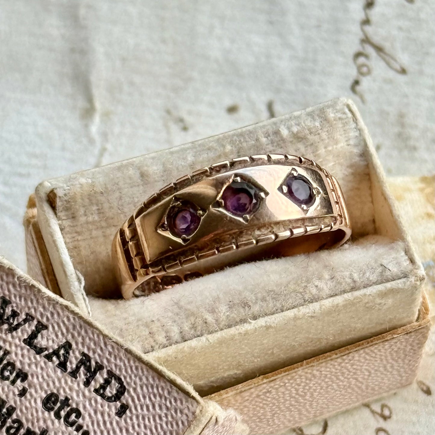 Victorian Amethyst Trilogy Ring in 9 Carat Gold; Circa 1896