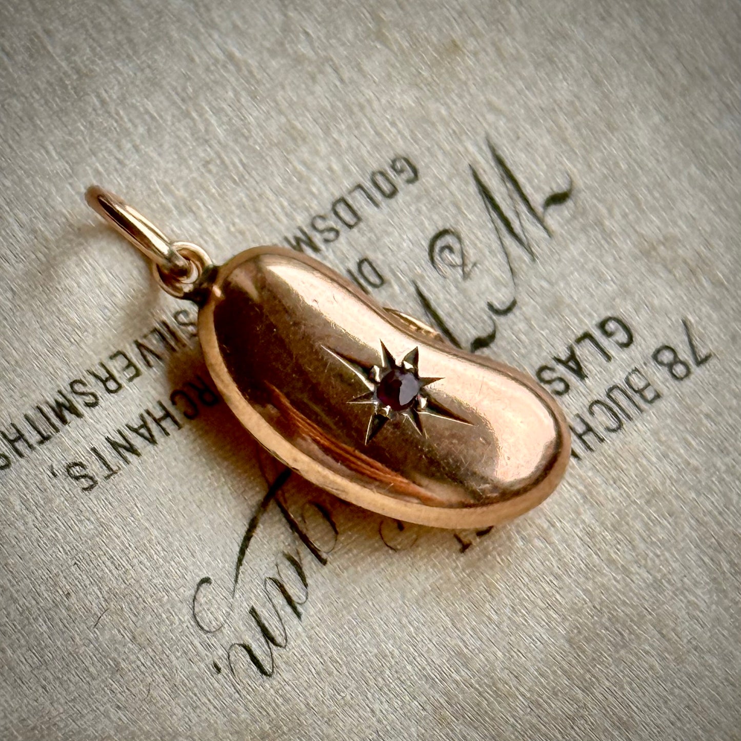 Victorian Lucky Ruby Kidney Bean Pendant 9 Carat Gold; Circa 1860