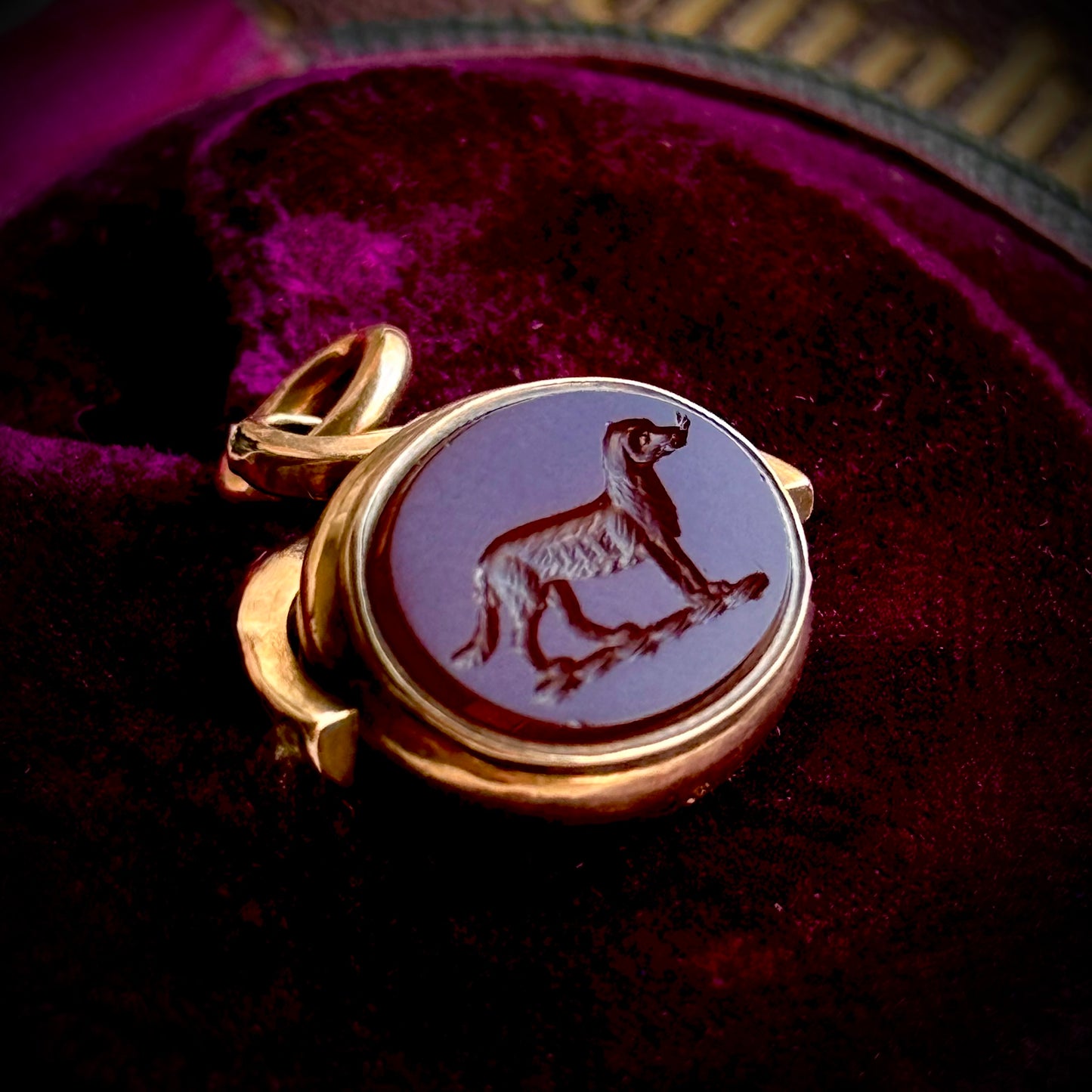 Antique Swivel Intaglio Dog  Pendant in 10 Carat Gold; Circa 1900