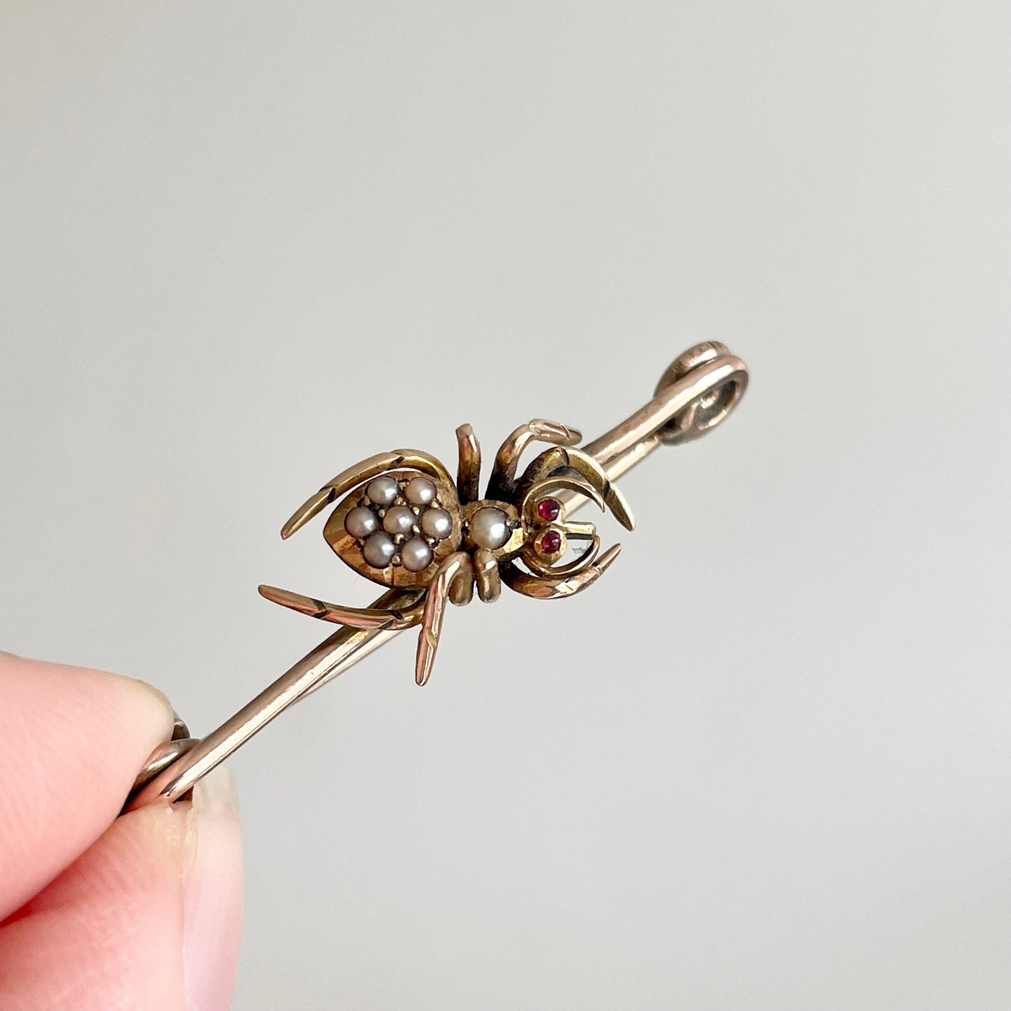 Victorian Spider Ruby and Pearl Brooch in 9 Carat Rose Gold; Circa 1890