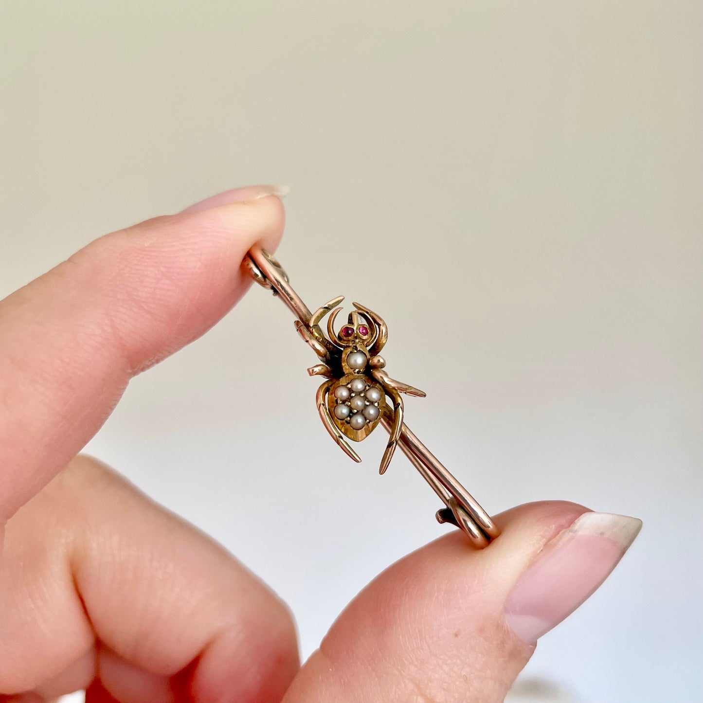 Victorian Spider Ruby and Pearl Brooch in 9 Carat Rose Gold; Circa 1890