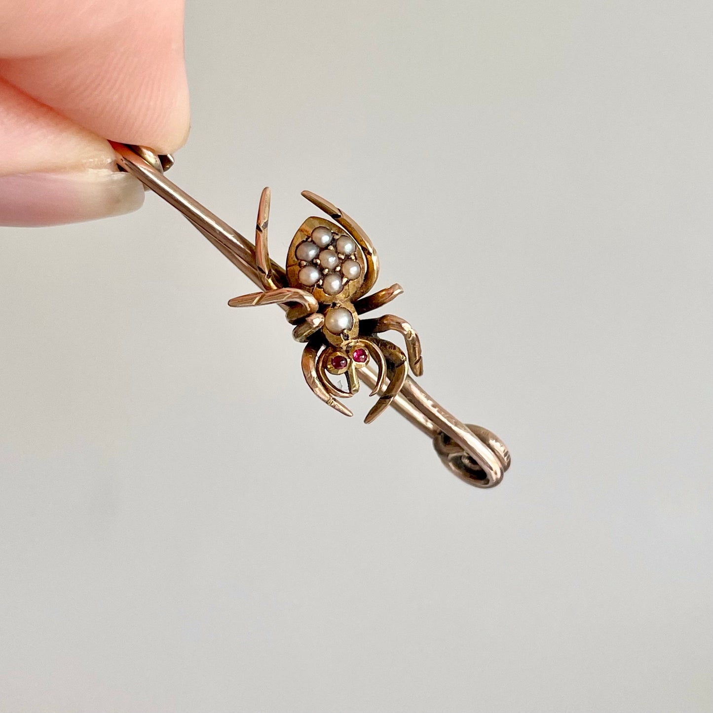 Victorian Spider Ruby and Pearl Brooch in 9 Carat Rose Gold; Circa 1890
