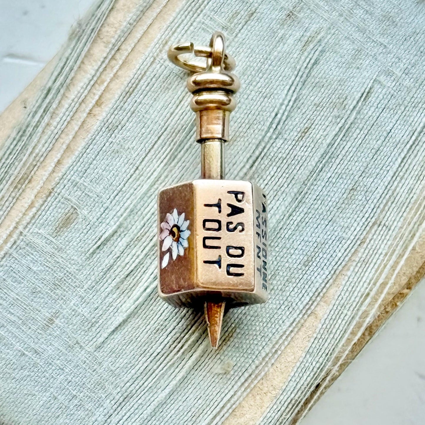 Victorian French 'Il Maime' Spinning Top Enamel Pendant; Circa 1880
